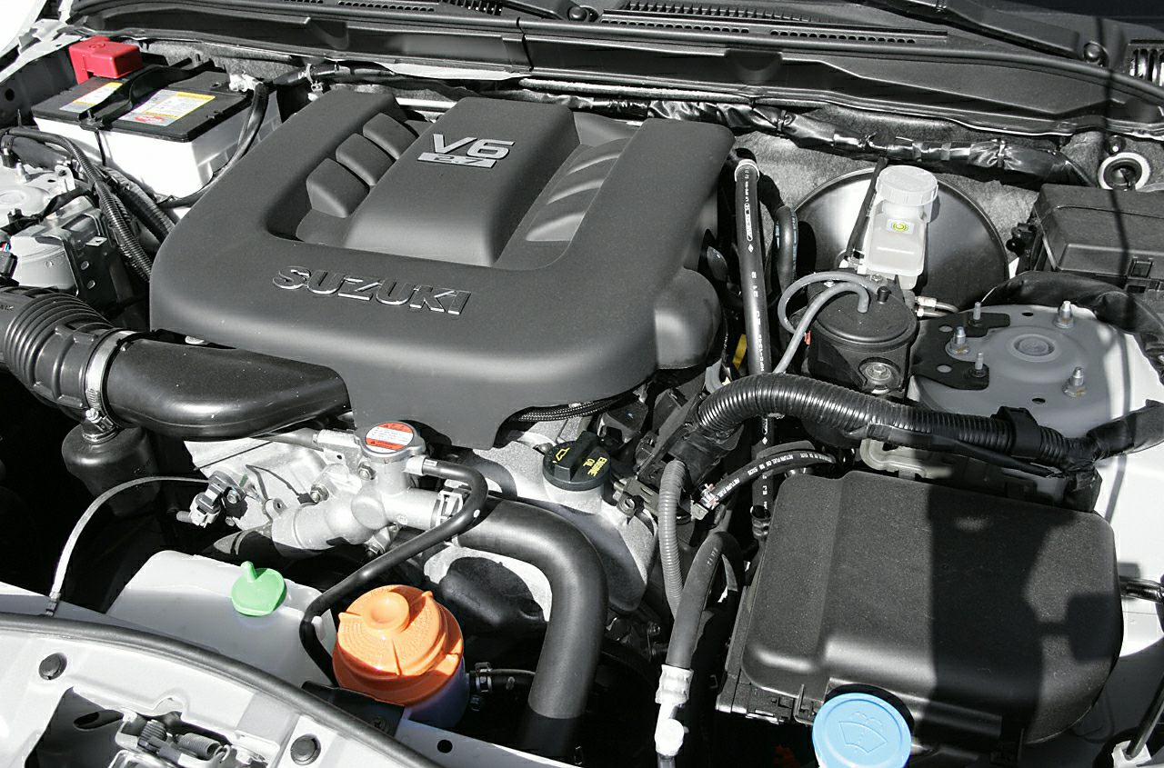 V6 engine bay with Suzuki-branded engine cover and visible components