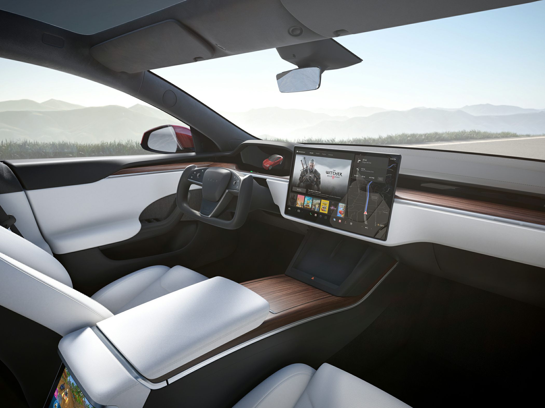 Modern electric car interior with yoke steering and large touchscreen.