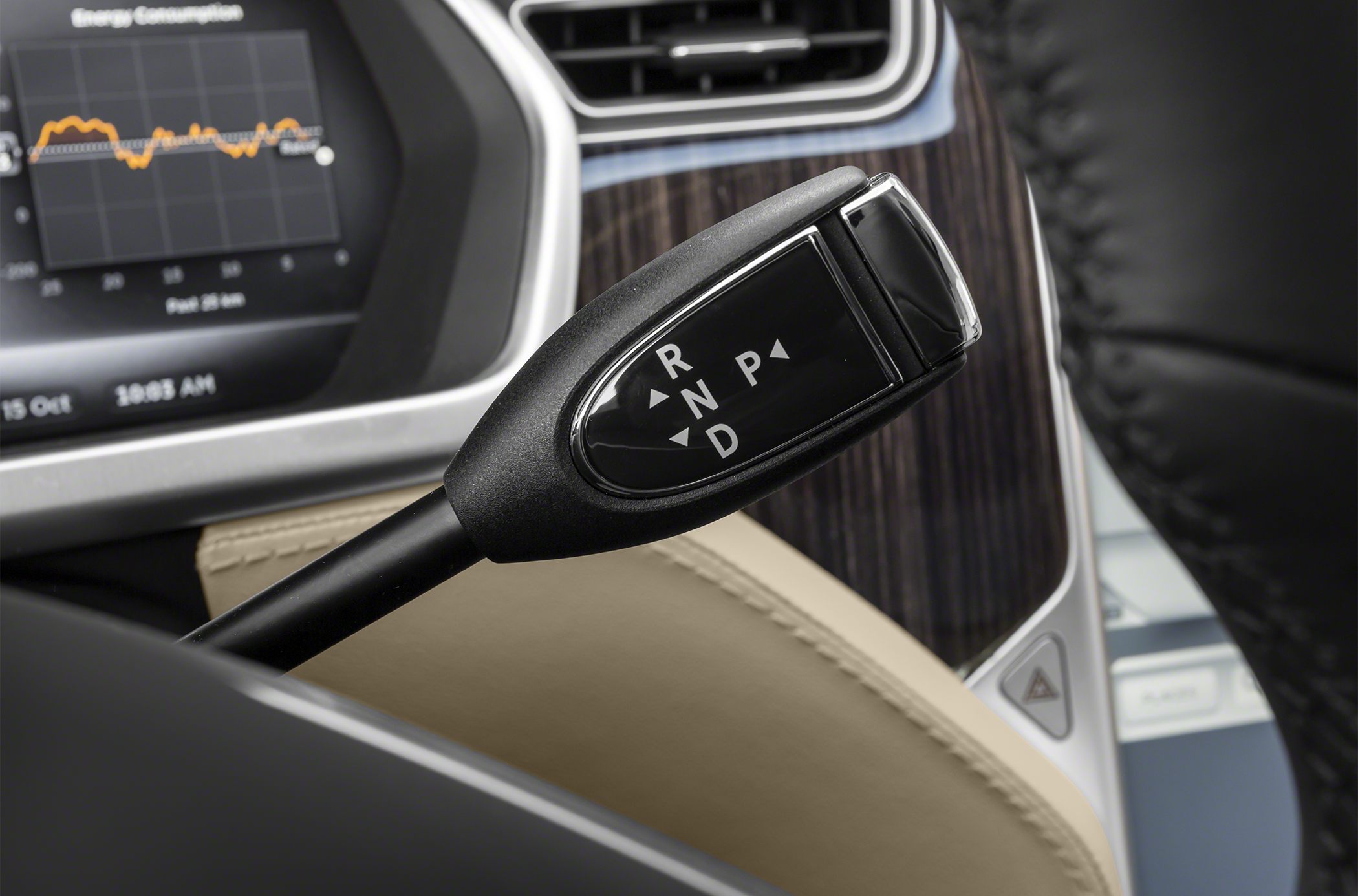 Close-up of gear selector lever with dashboard in Tesla Model S interior