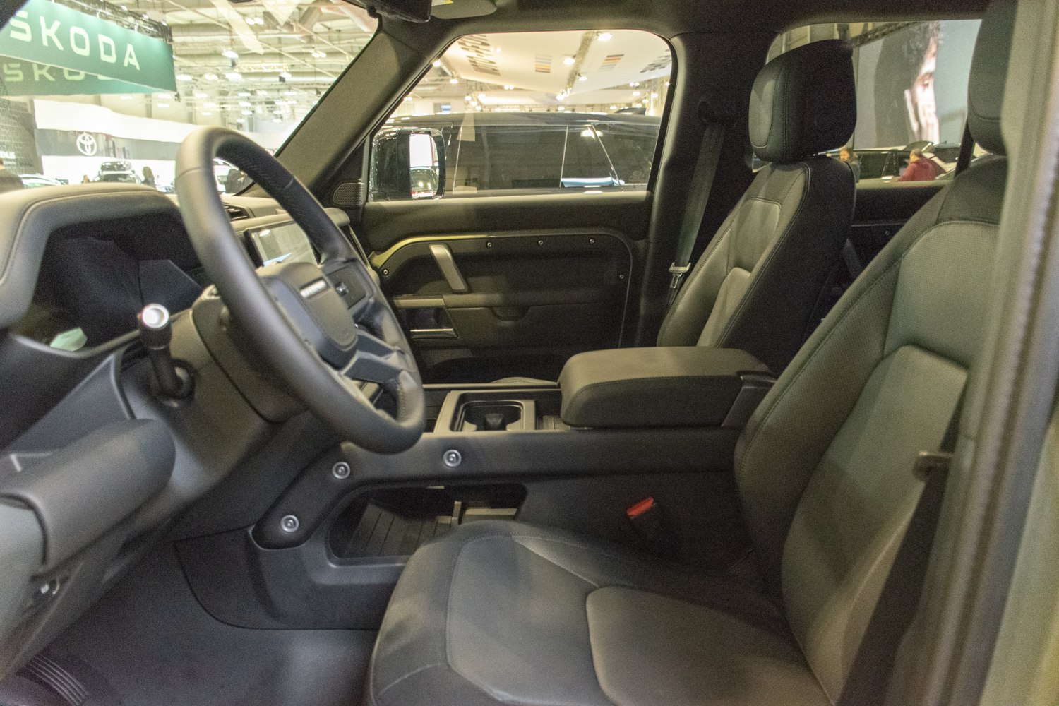 Modern SUV interior with leather seats and steering wheel