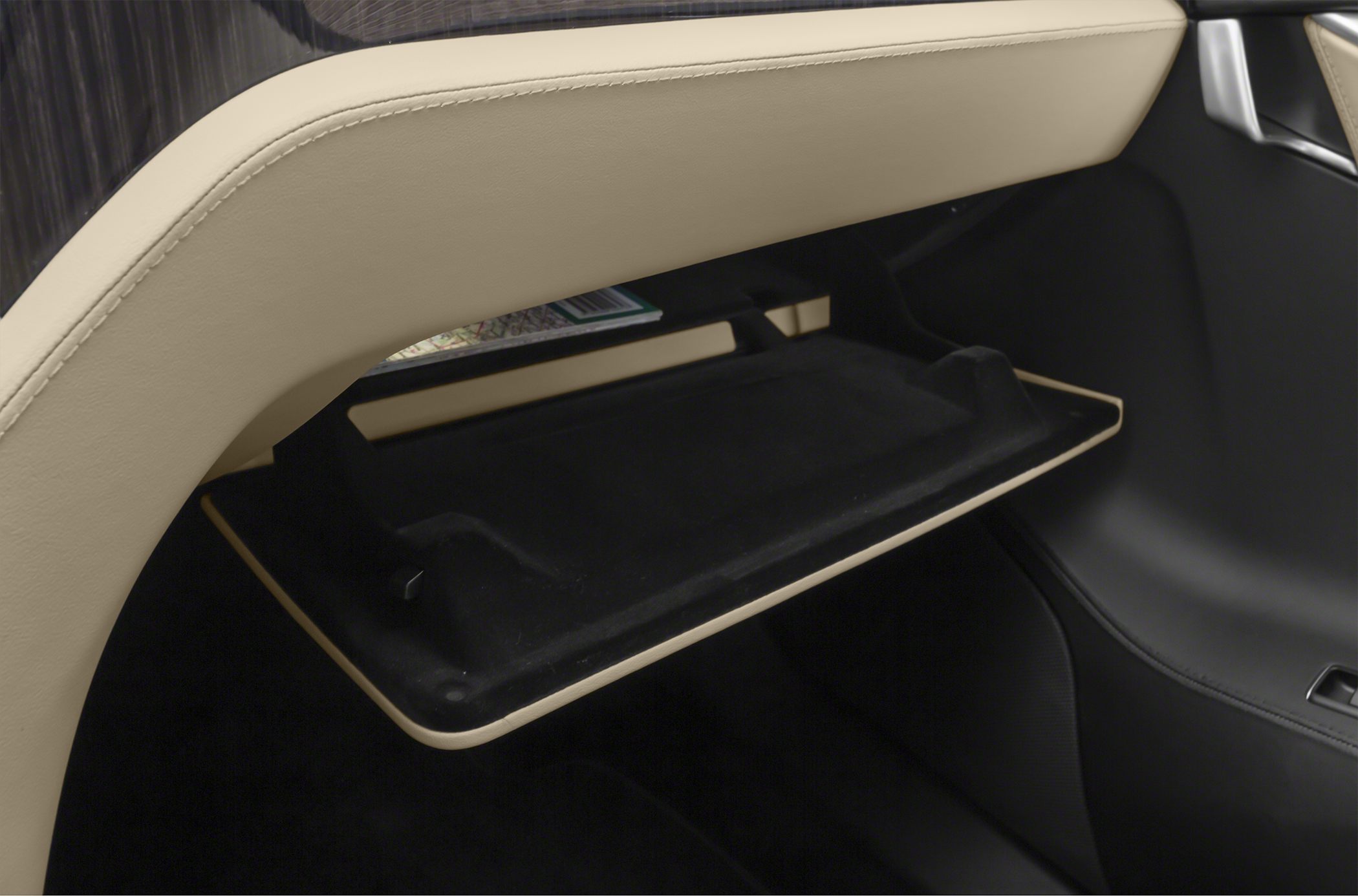Open glove compartment with beige interior trim