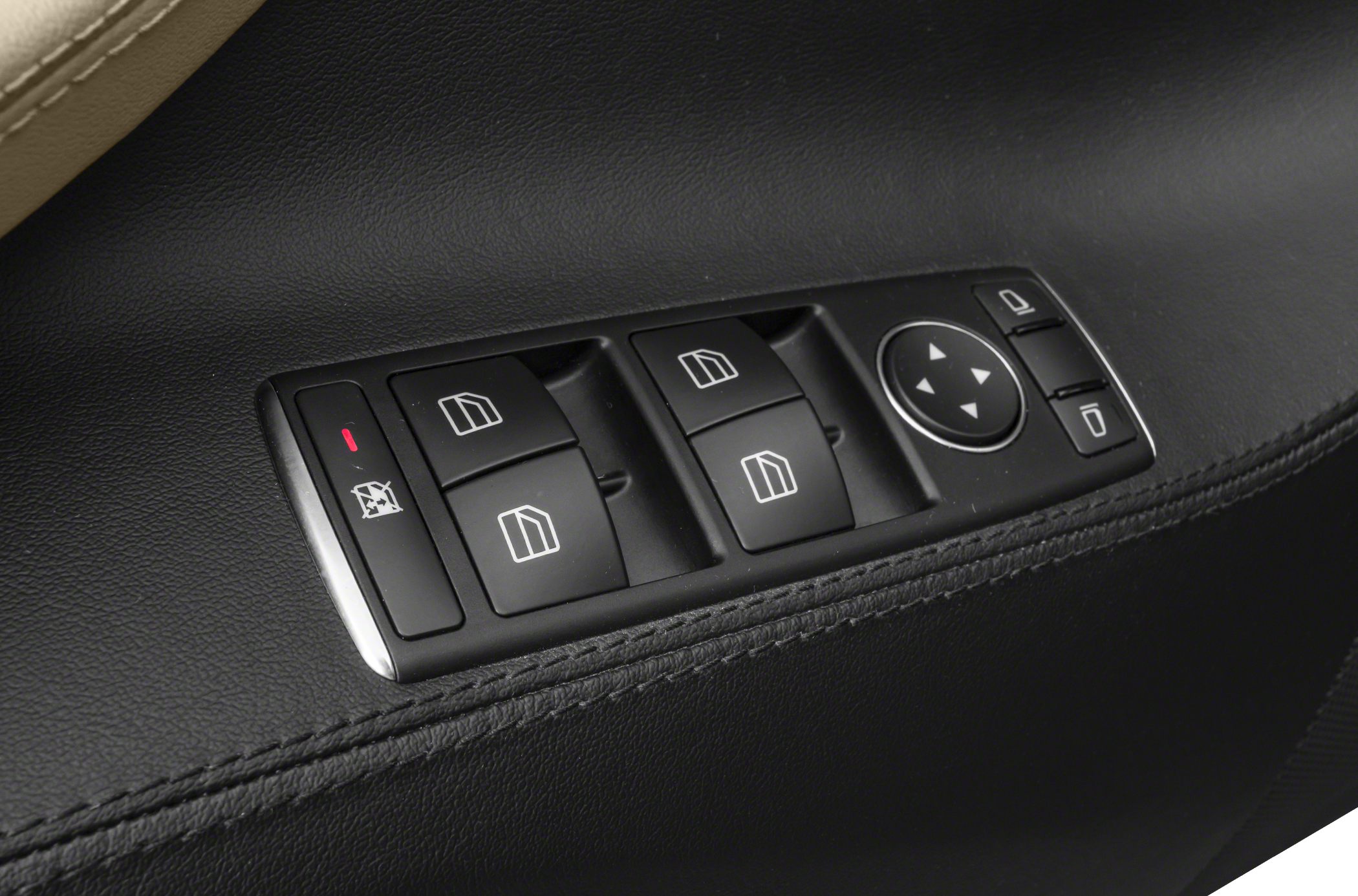 Power window switches and mirror adjustment control on a black door panel.