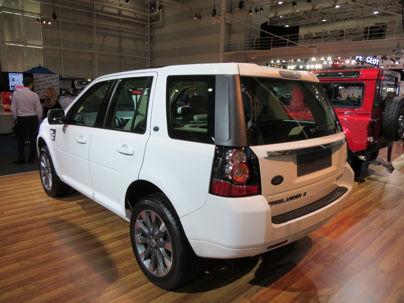 Rear and side view of a white SUV with alloy wheels and distinct taillights