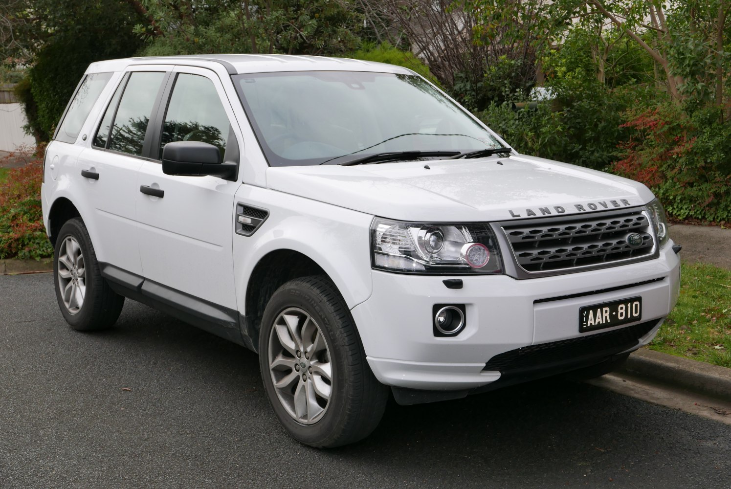 Front-side view of SUV with LED headlights and alloy wheels