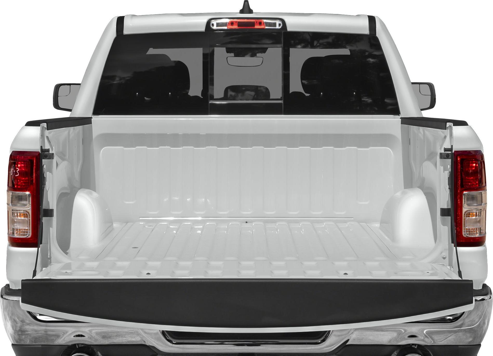 Open pickup truck cargo bed with tailgate down, visible wheel wells and rear window.