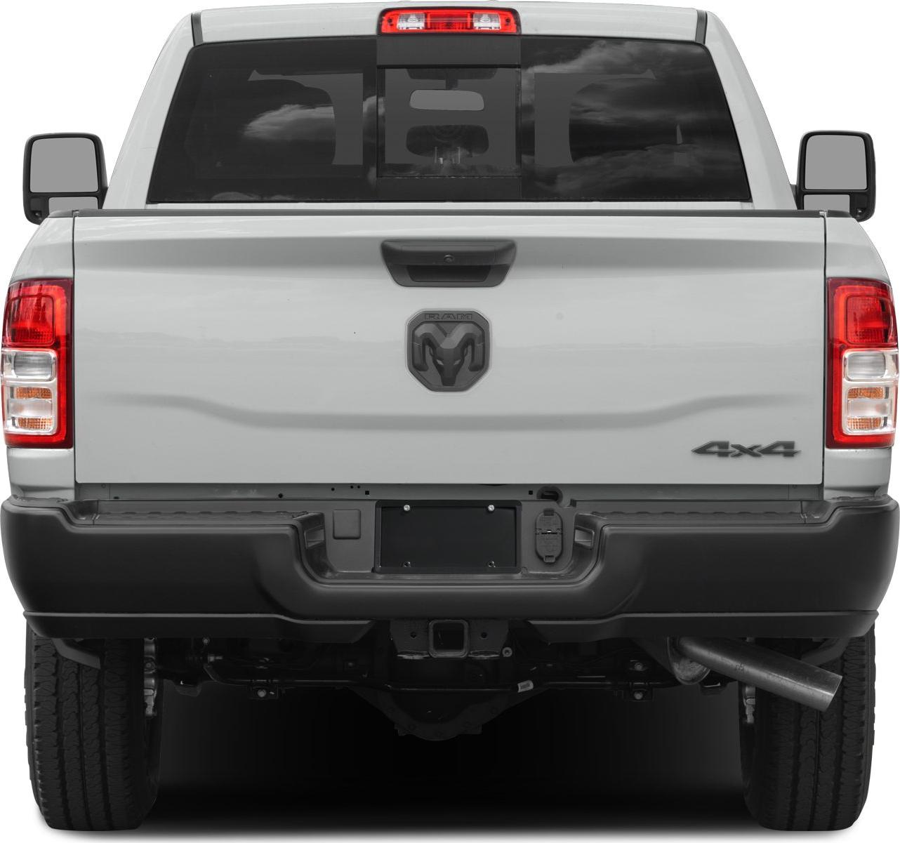 Rear view of pickup showcasing tailgate, taillights, bumper, 4x4 badge.