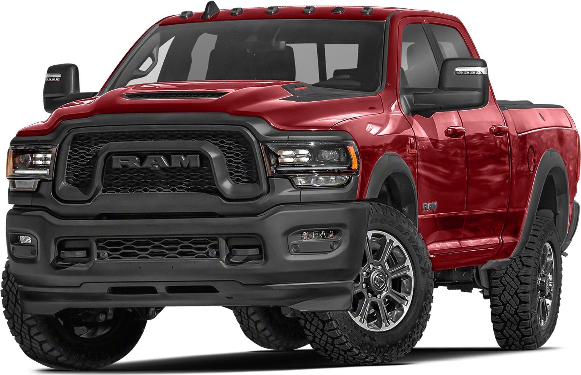 Robust black front grille and all-terrain tires on rugged pickup
