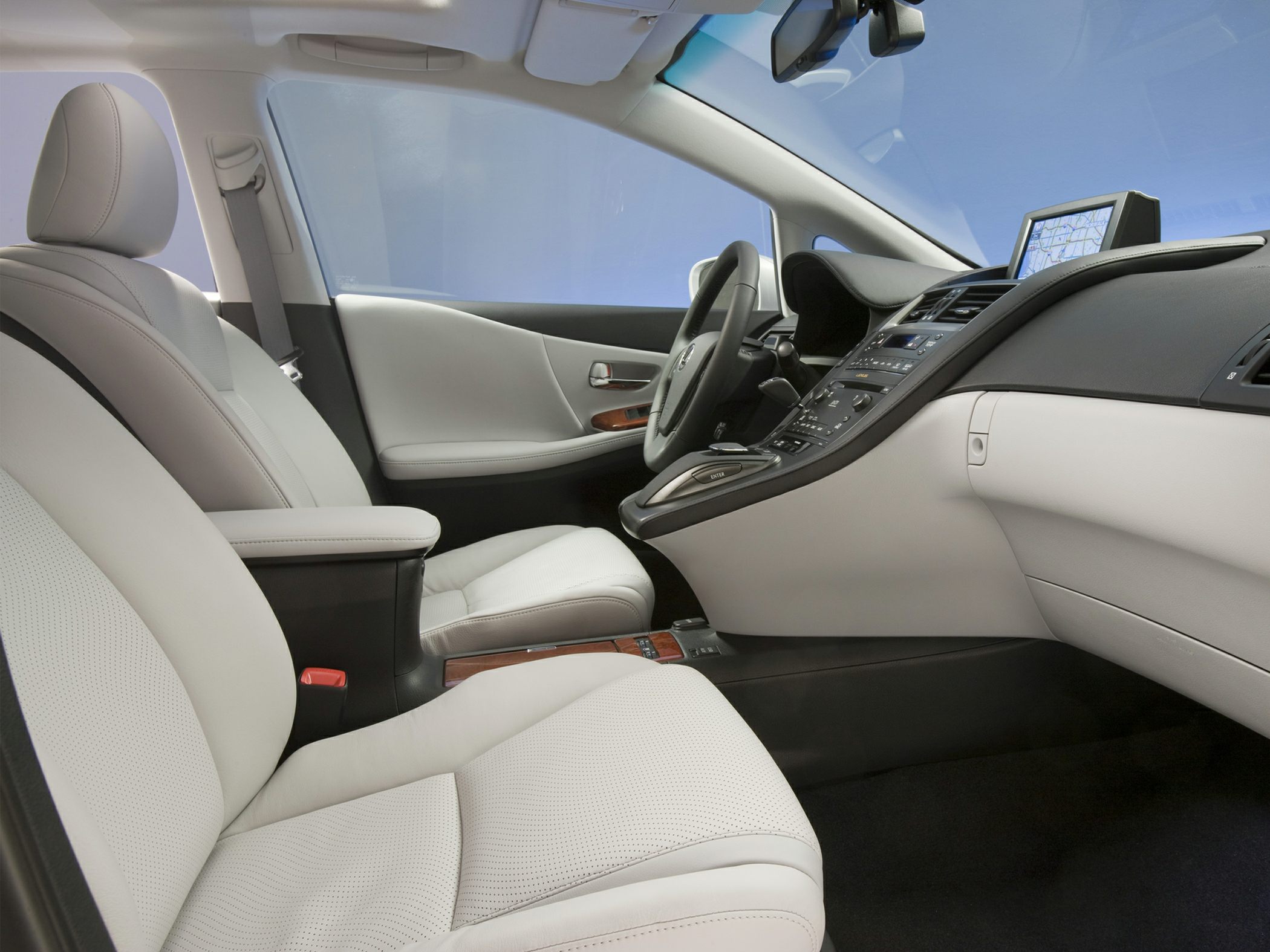 Leather seats and dashboard with navigation system and wood trim accents