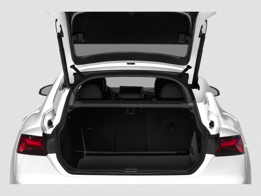 Open rear trunk and spacious cargo area of a modern hatchback car