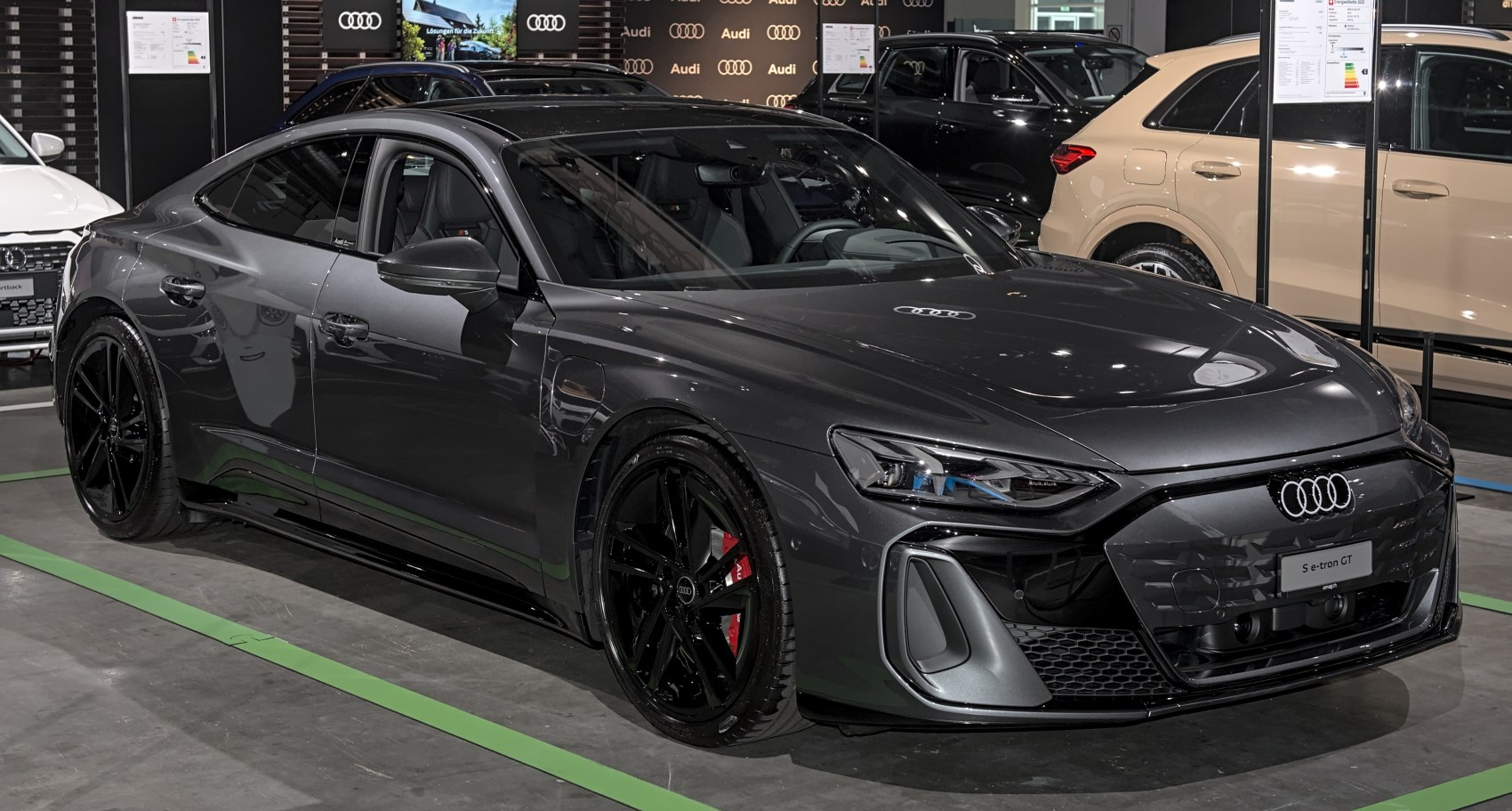 Aerodynamic electric sport sedan with sleek design and black wheels