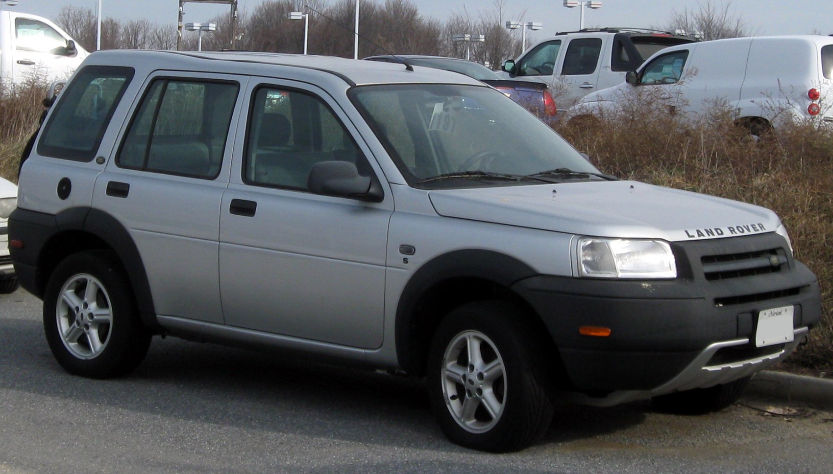 Front grill and side profile with distinctive headlights and rugged bumper