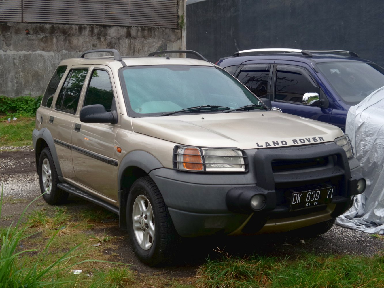Front view with prominent brush guard and rugged SUV design