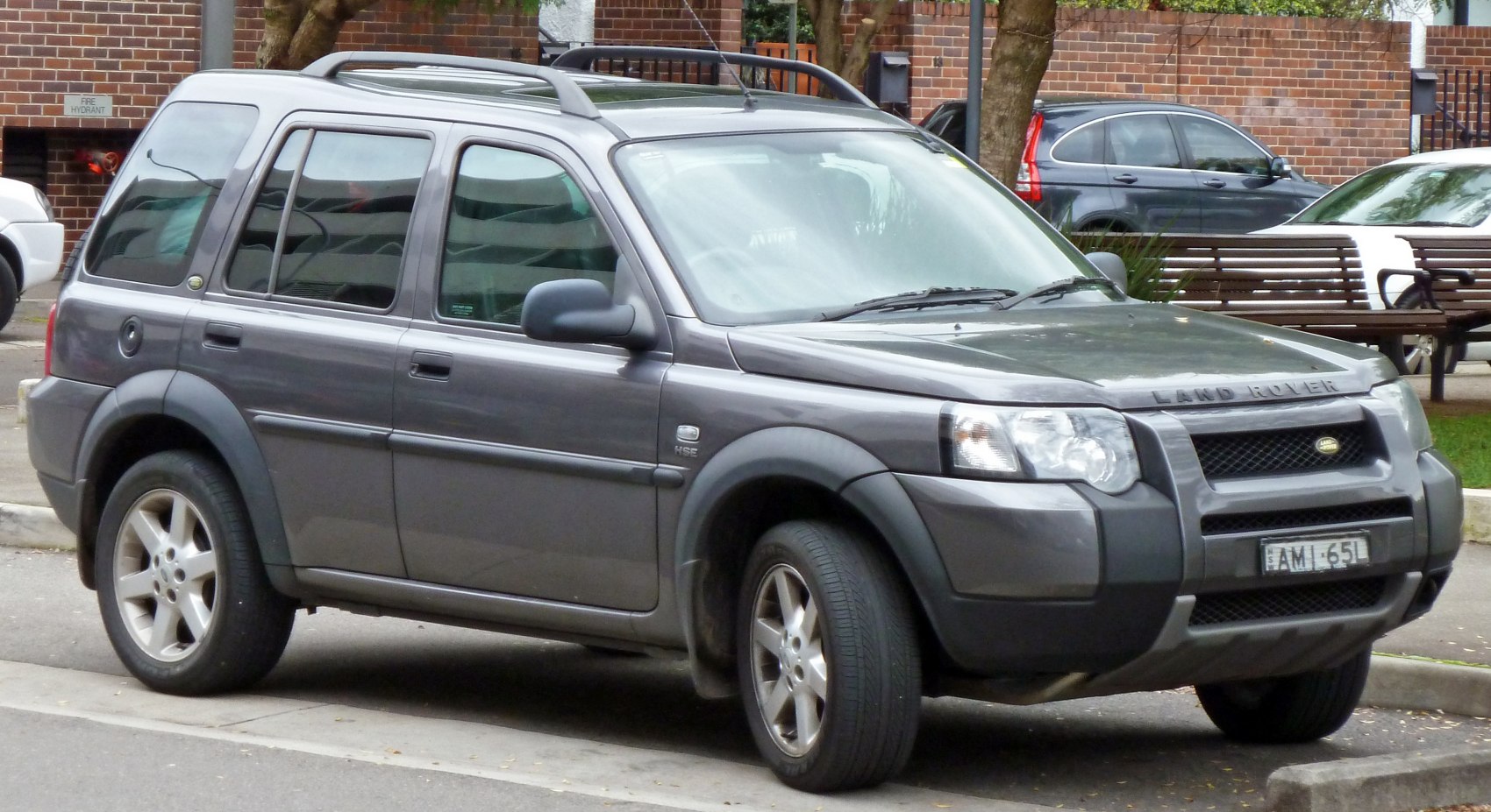 SUV with roof rails and black plastic body cladding
