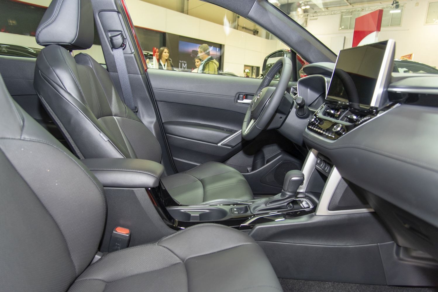 Leather seats and large touchscreen in modern vehicle interior