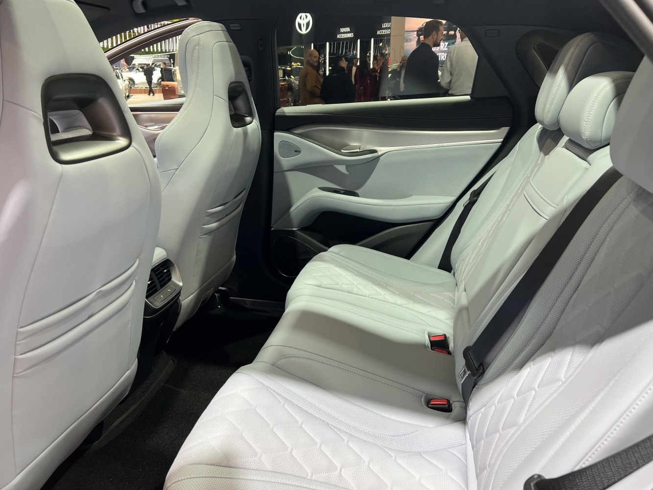 White leather rear seats with quilted design and spacious legroom.