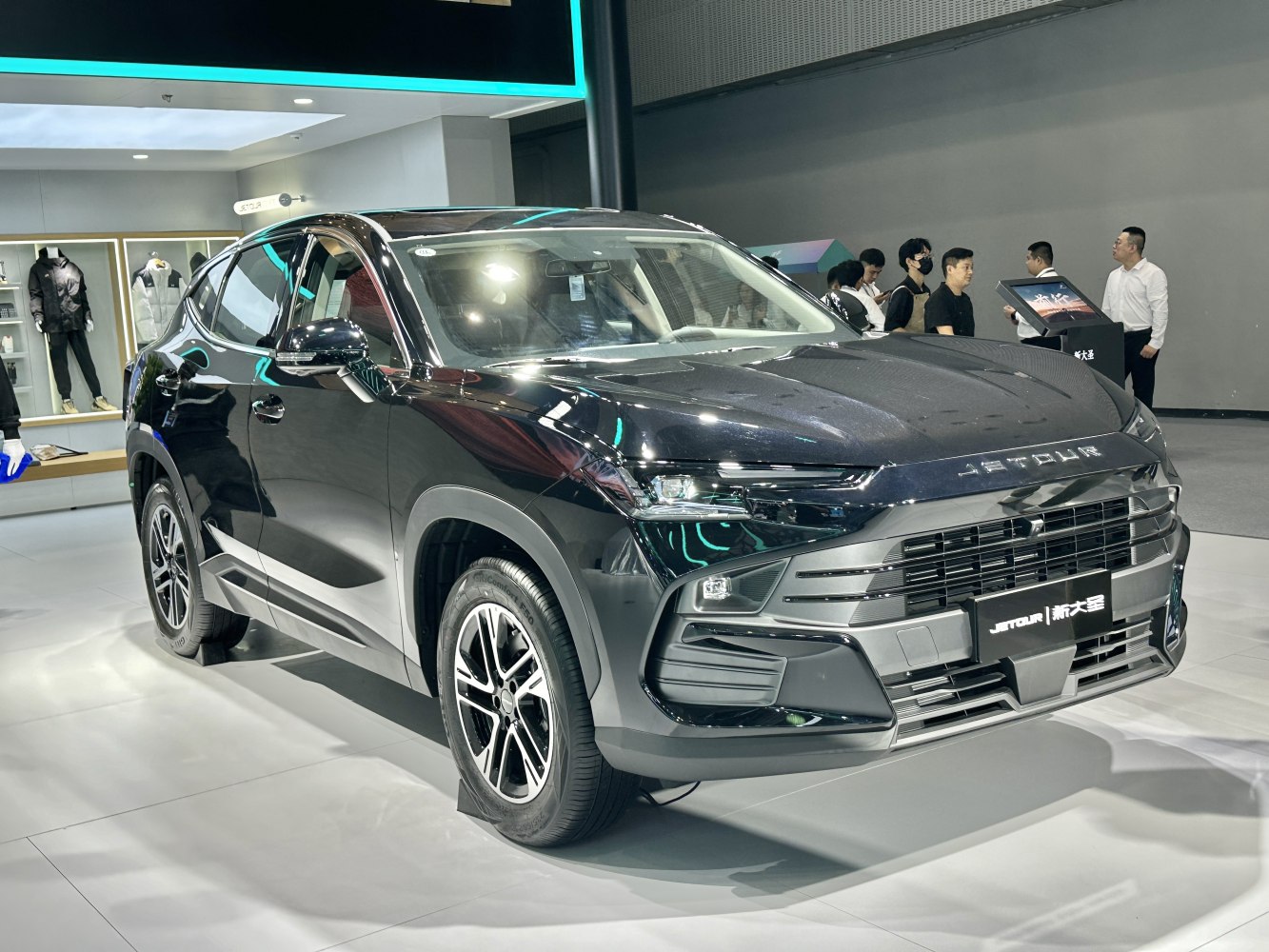 Black SUV with sleek front fascia and LED headlights.
