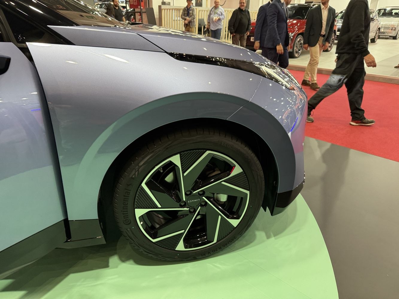 Close-up of front wheel and fender with modern alloy rim design