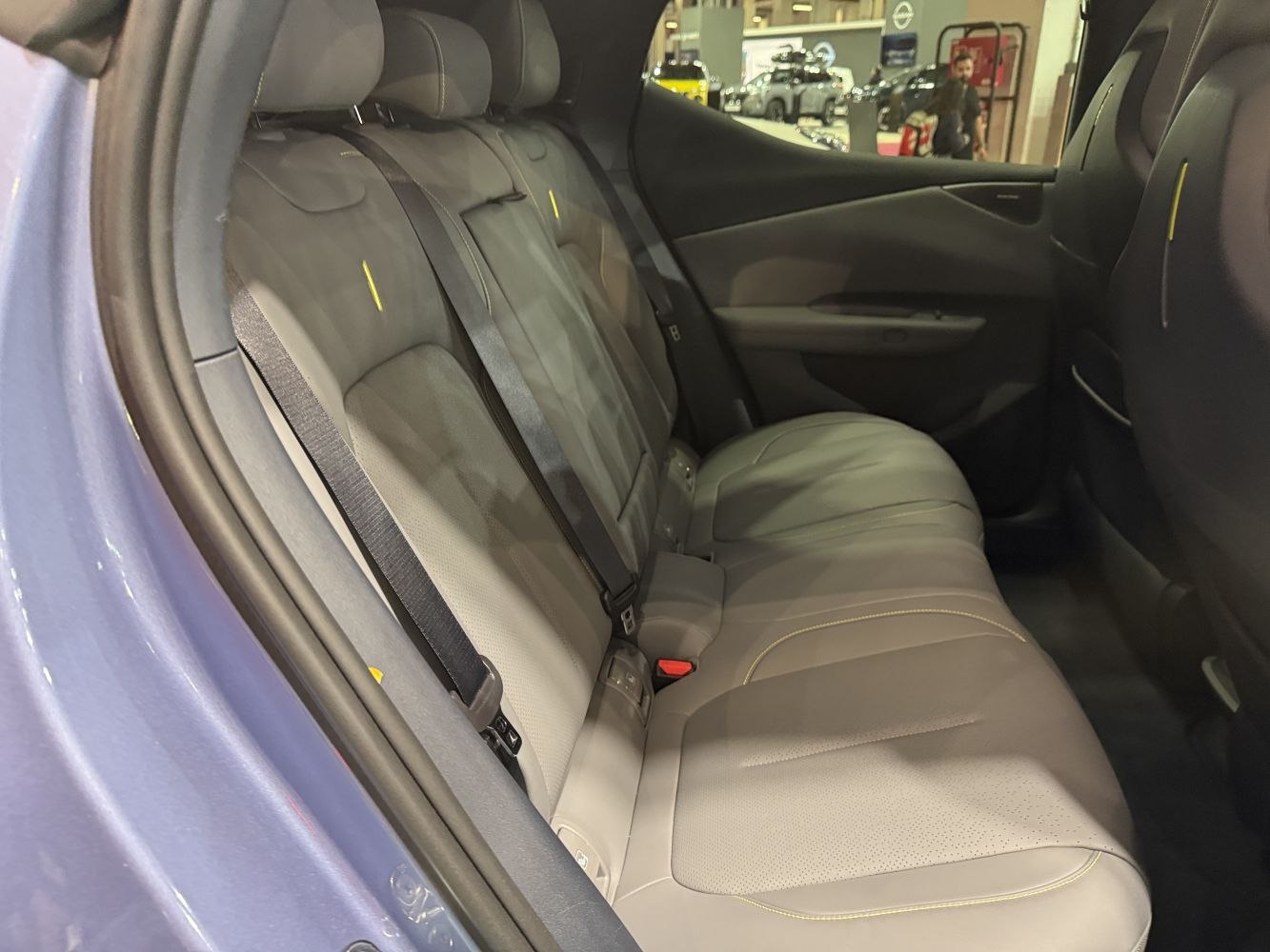Rear seat interior with leather upholstery and seat belts