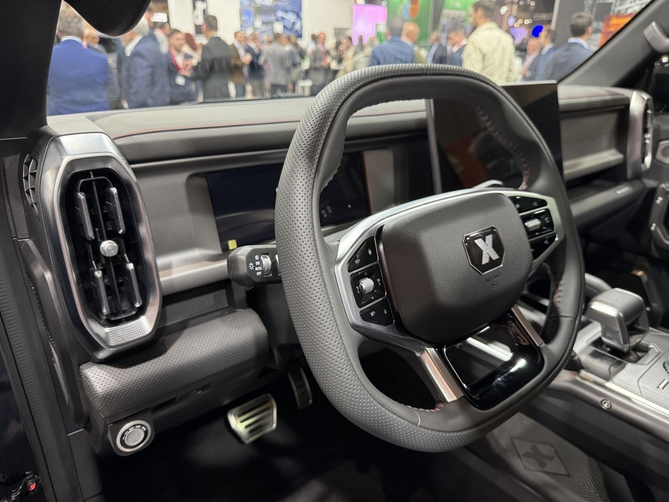 Modern steering wheel with controls and digital dashboard display