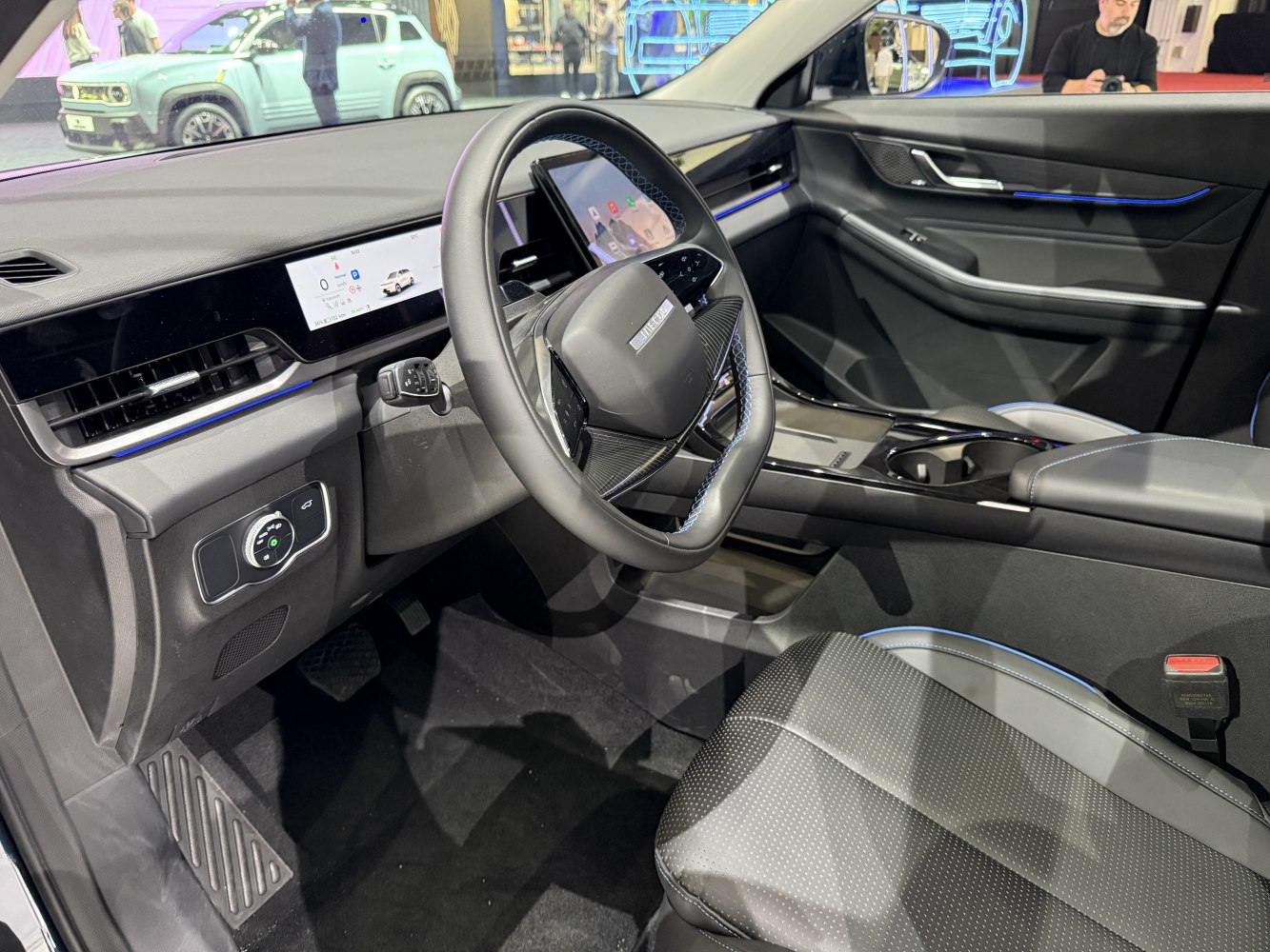 Digital dashboard and modern steering wheel in car interior
