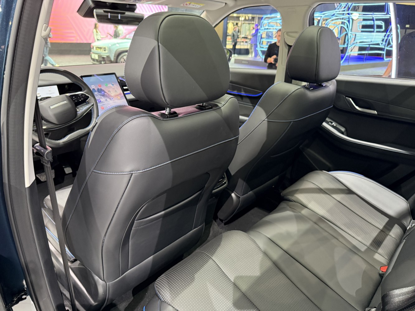 Rear leather seats and digital touchscreen dashboard interior