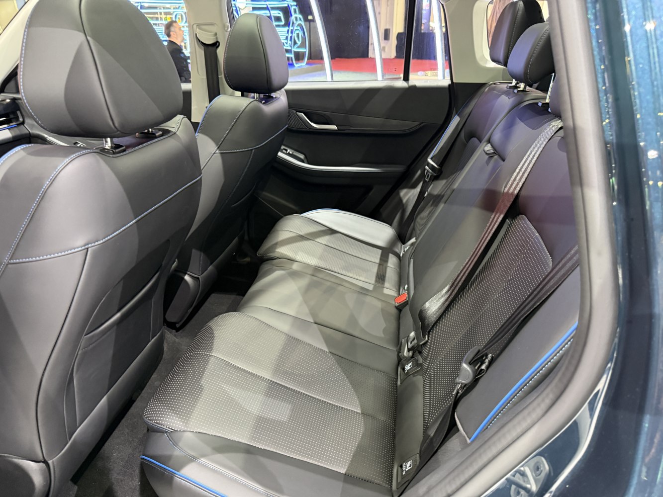 Spacious rear seating with leather upholstery and detailed stitching