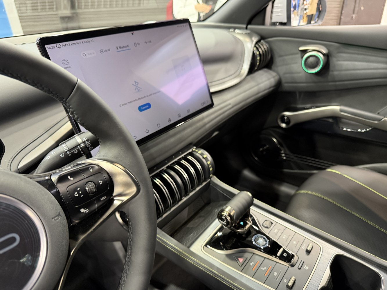 Dashboard with large touchscreen and modern gear shifter