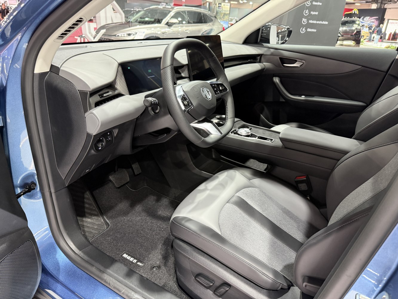 Modern electric vehicle cabin with digital dashboard and ergonomic seats