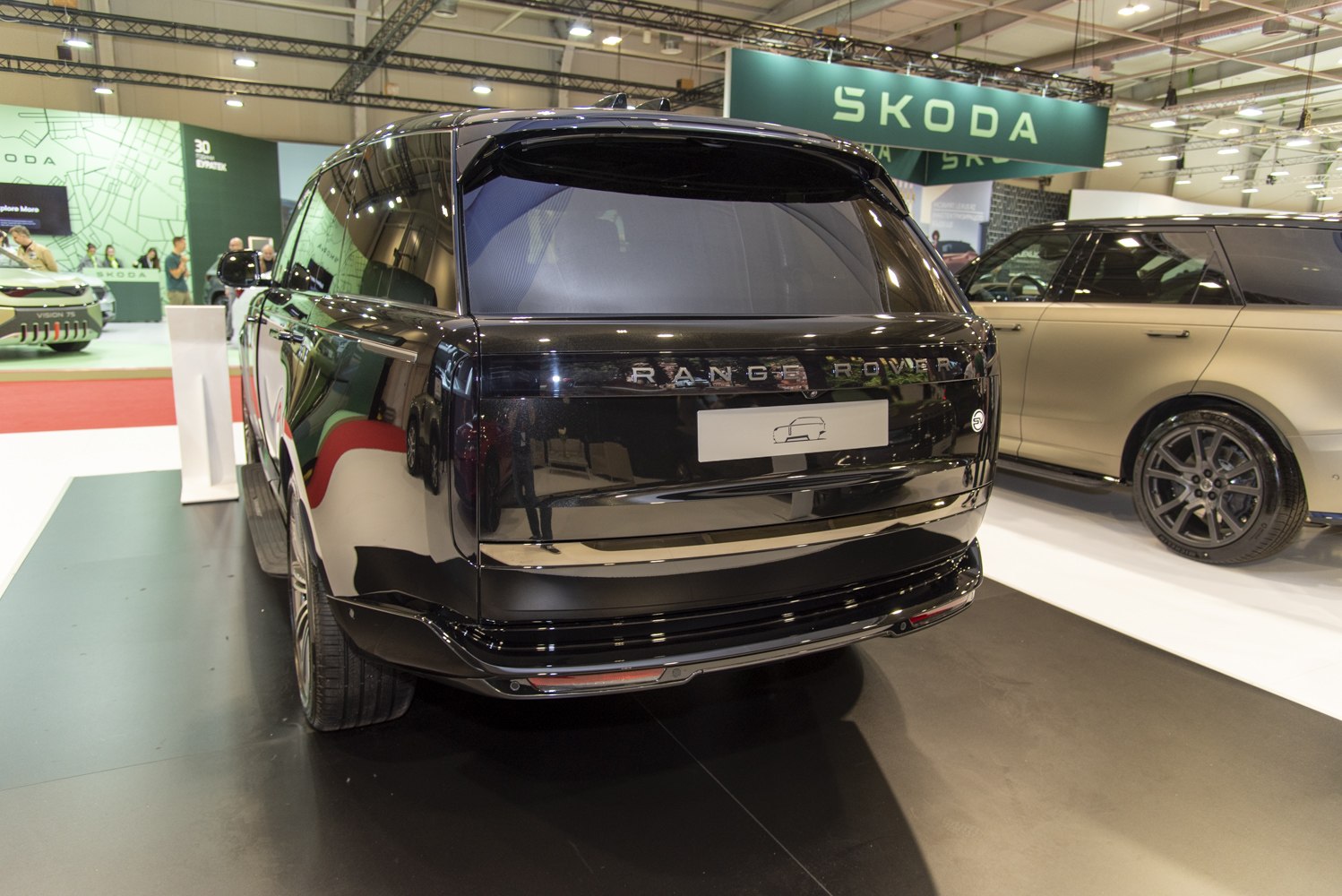 Rear view of a sleek luxury SUV with tinted windows and modern design.