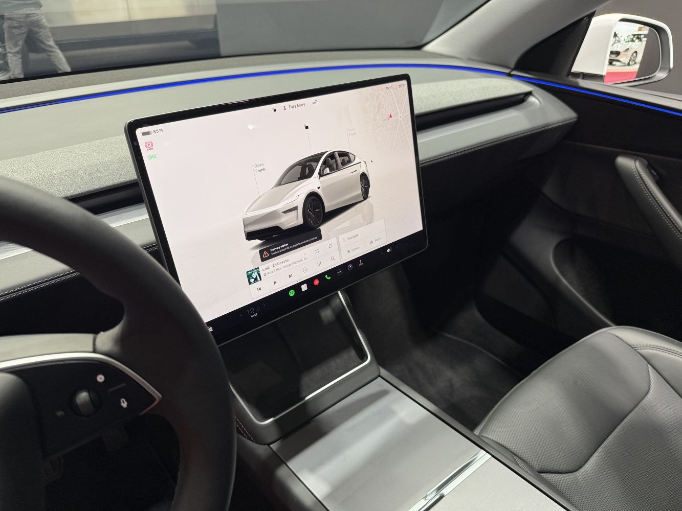 Interior cabin with large vertical touchscreen and minimalist dashboard