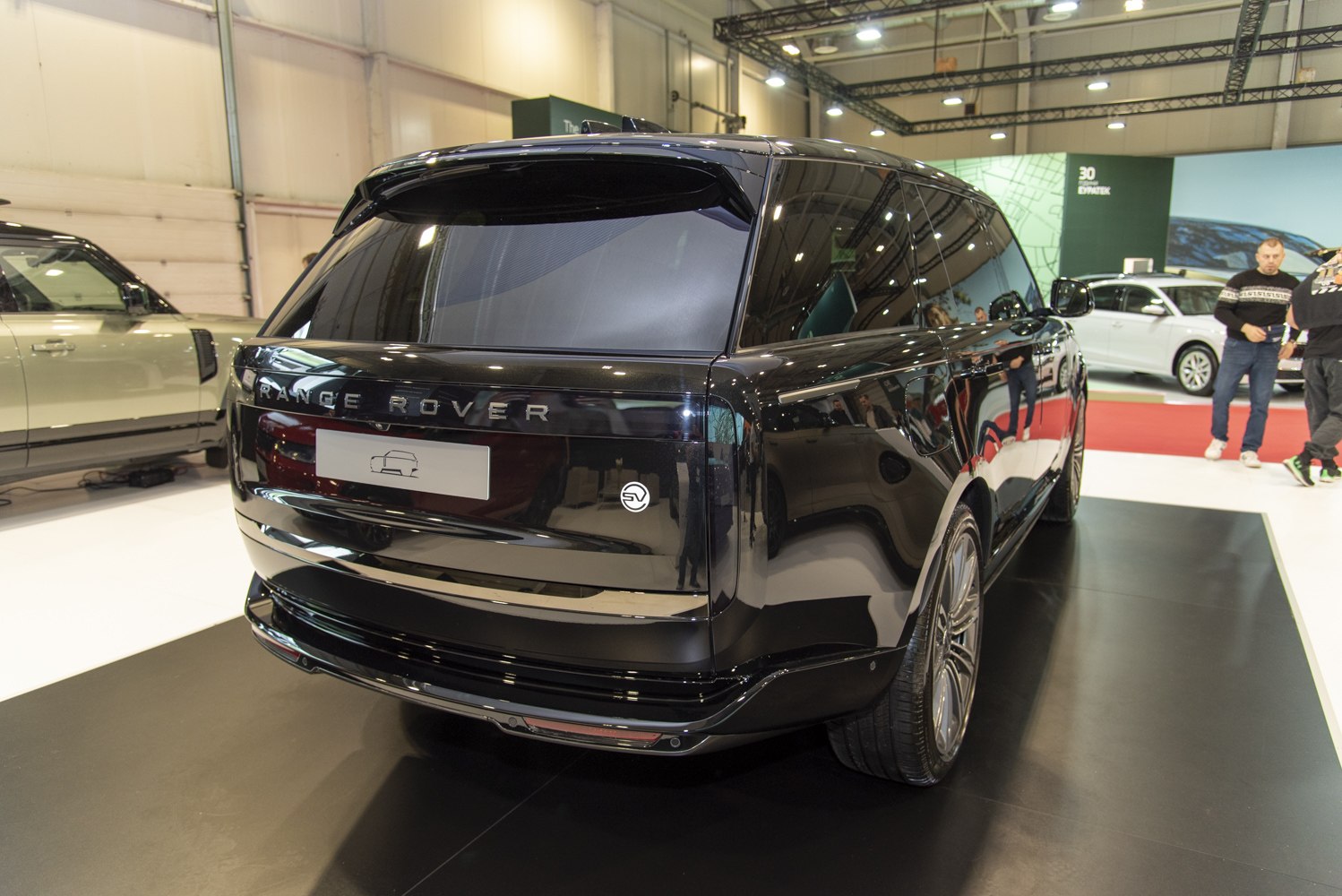 Black luxury SUV with distinctive rear design and glossy finish