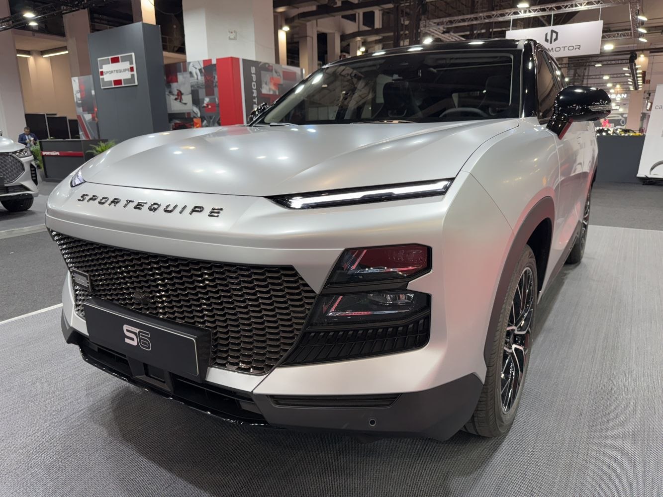 Front with sleek LED headlights and large black grille