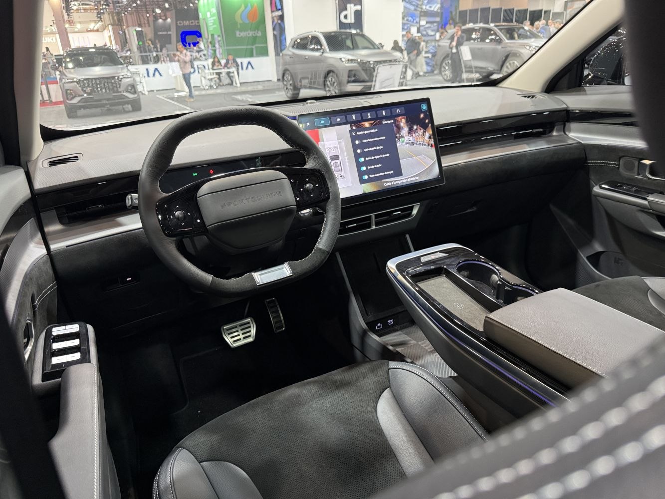 Digital dashboard and large central touchscreen display in a modern car interior
