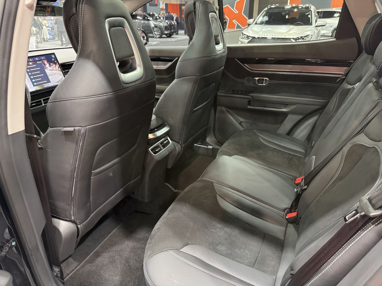 Leather and suede rear seats with center console and digital dashboard