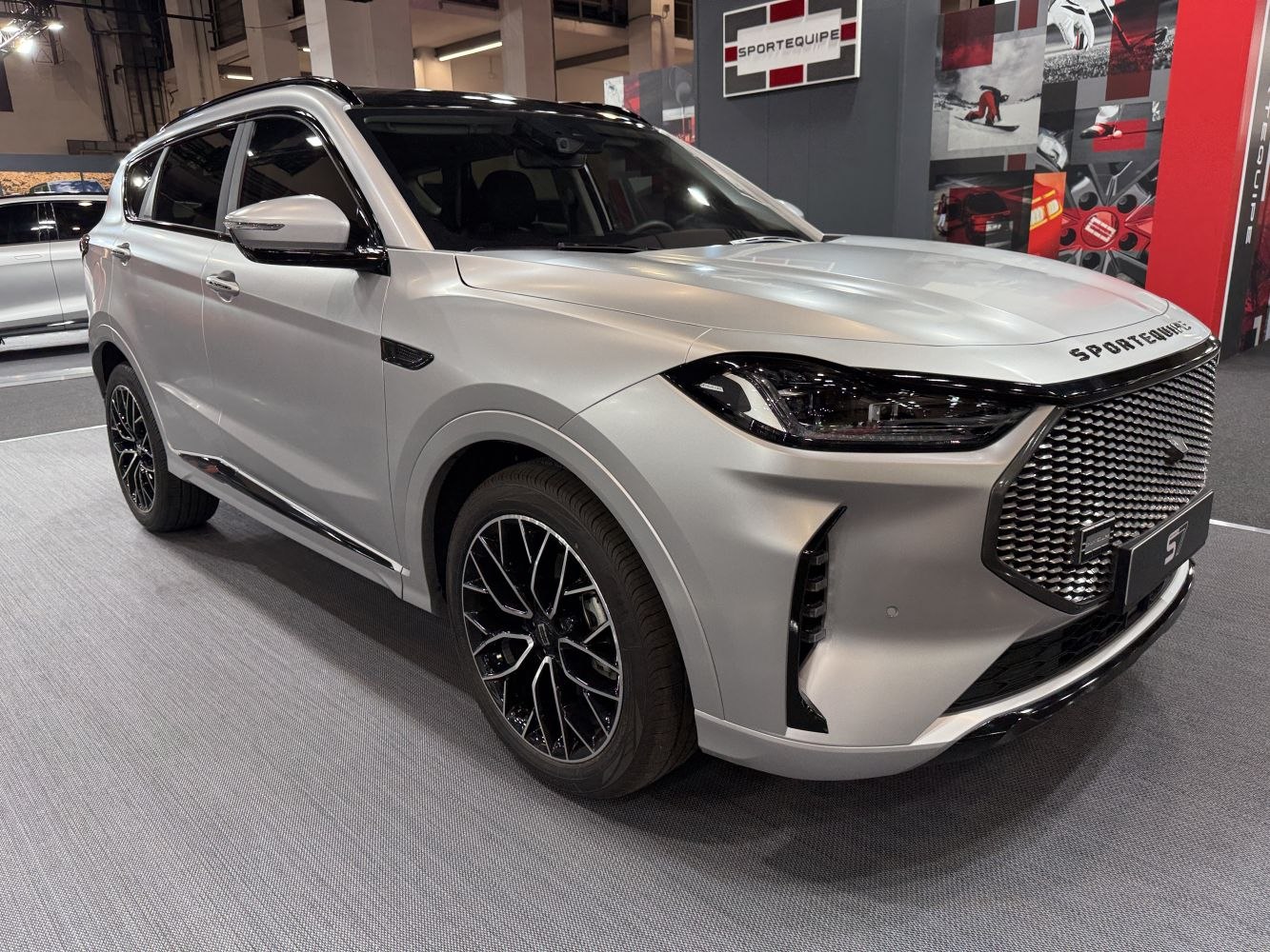 Front view of SUV with bold grille, LED headlights, and alloy wheels