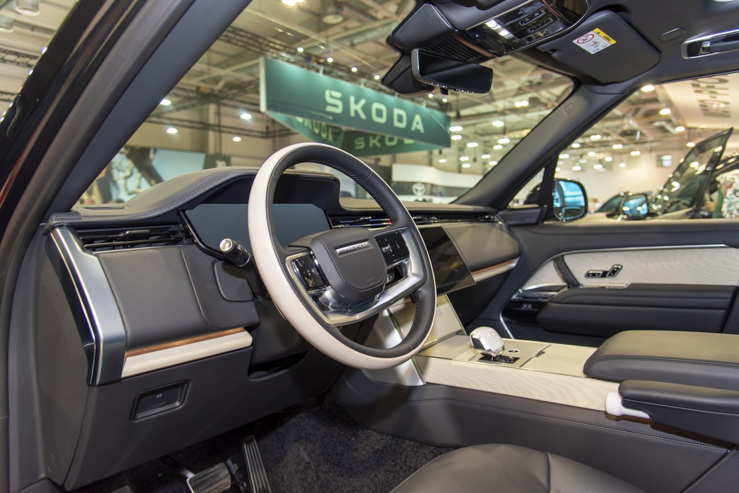Luxury steering wheel and modern dashboard design in car interior
