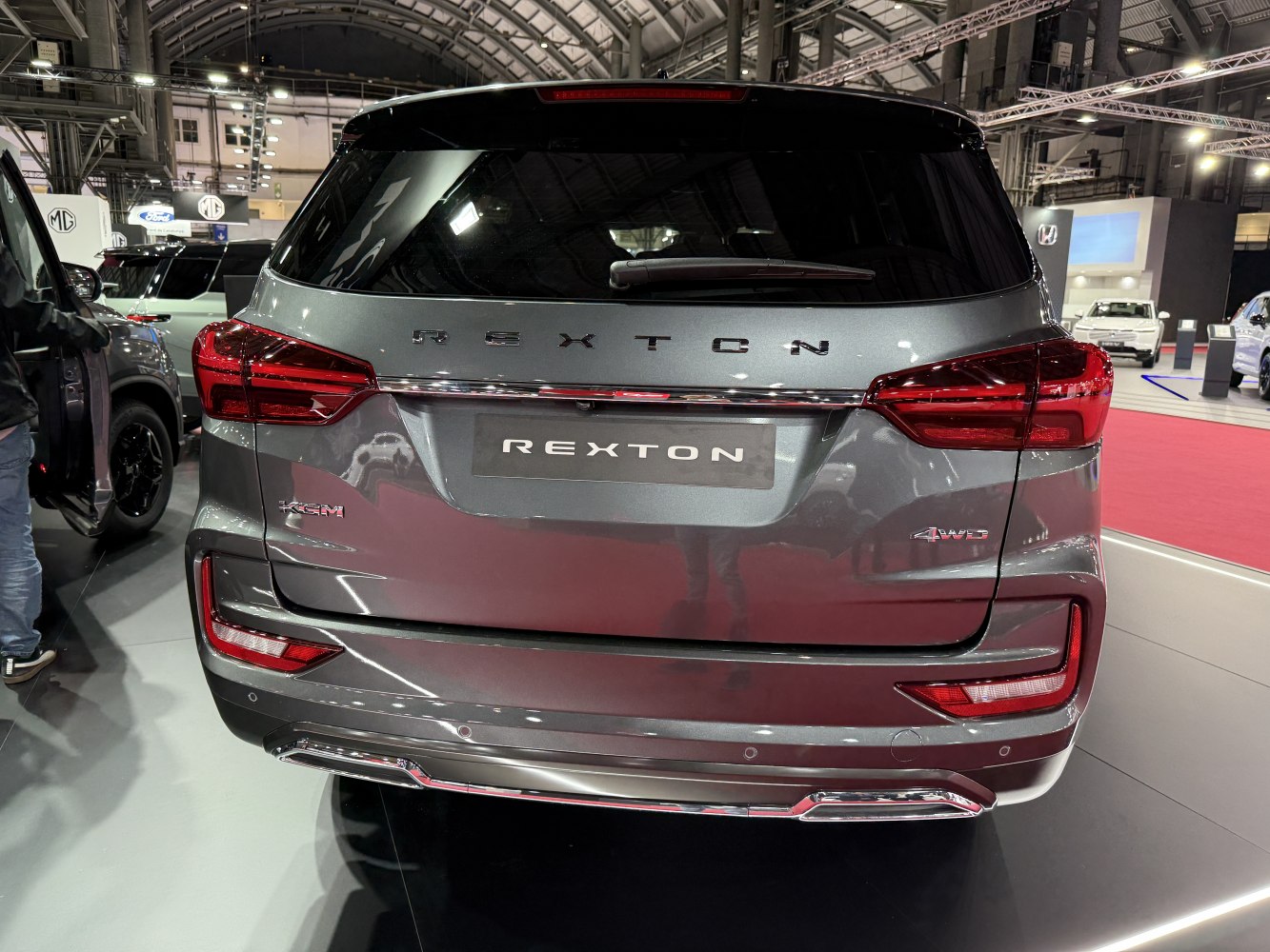 Rear view focusing on SUV tailgate, taillights, and 4WD badge