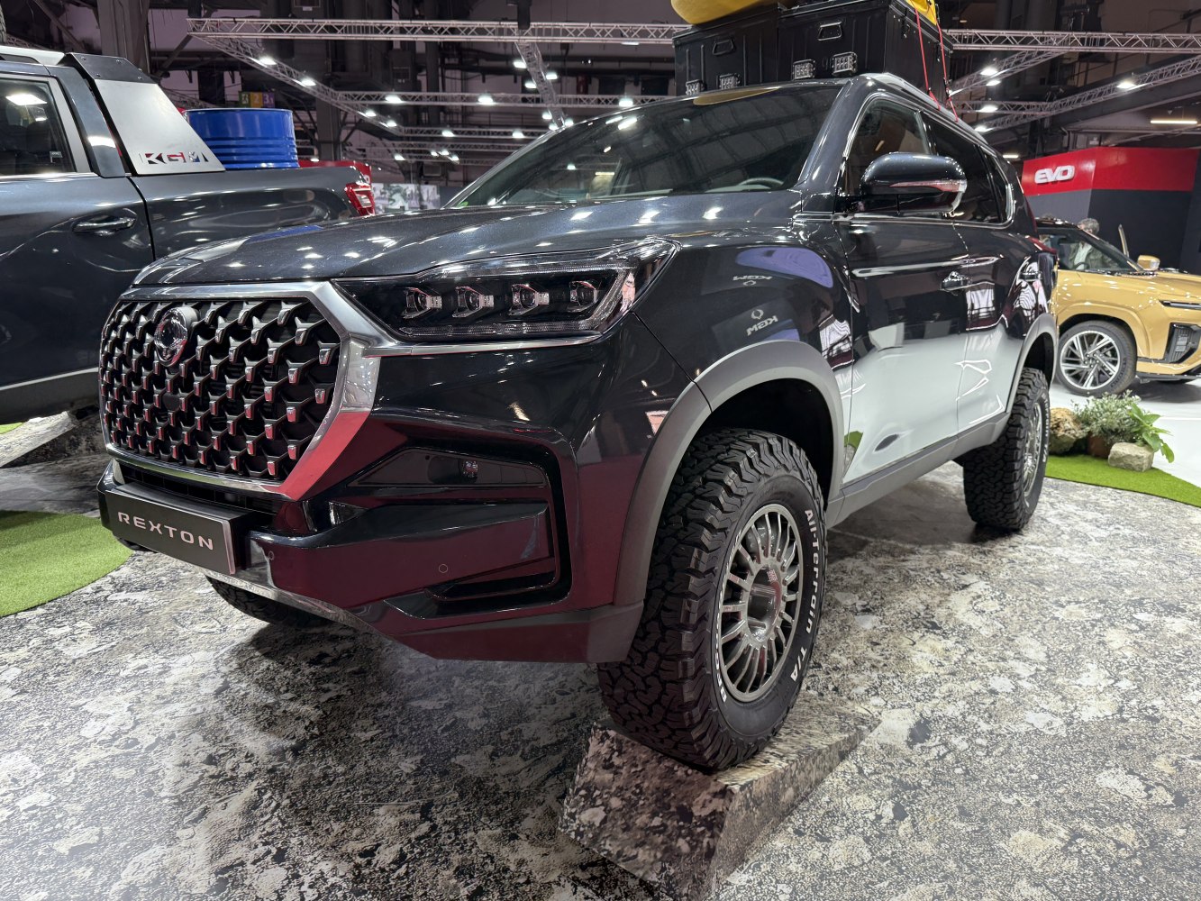 Bold front grille and off-road all-terrain tires on modern SUV