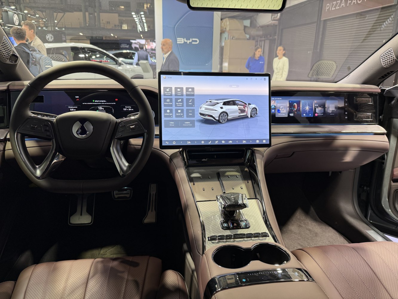 Futuristic steering wheel, dual digital displays, leather seats