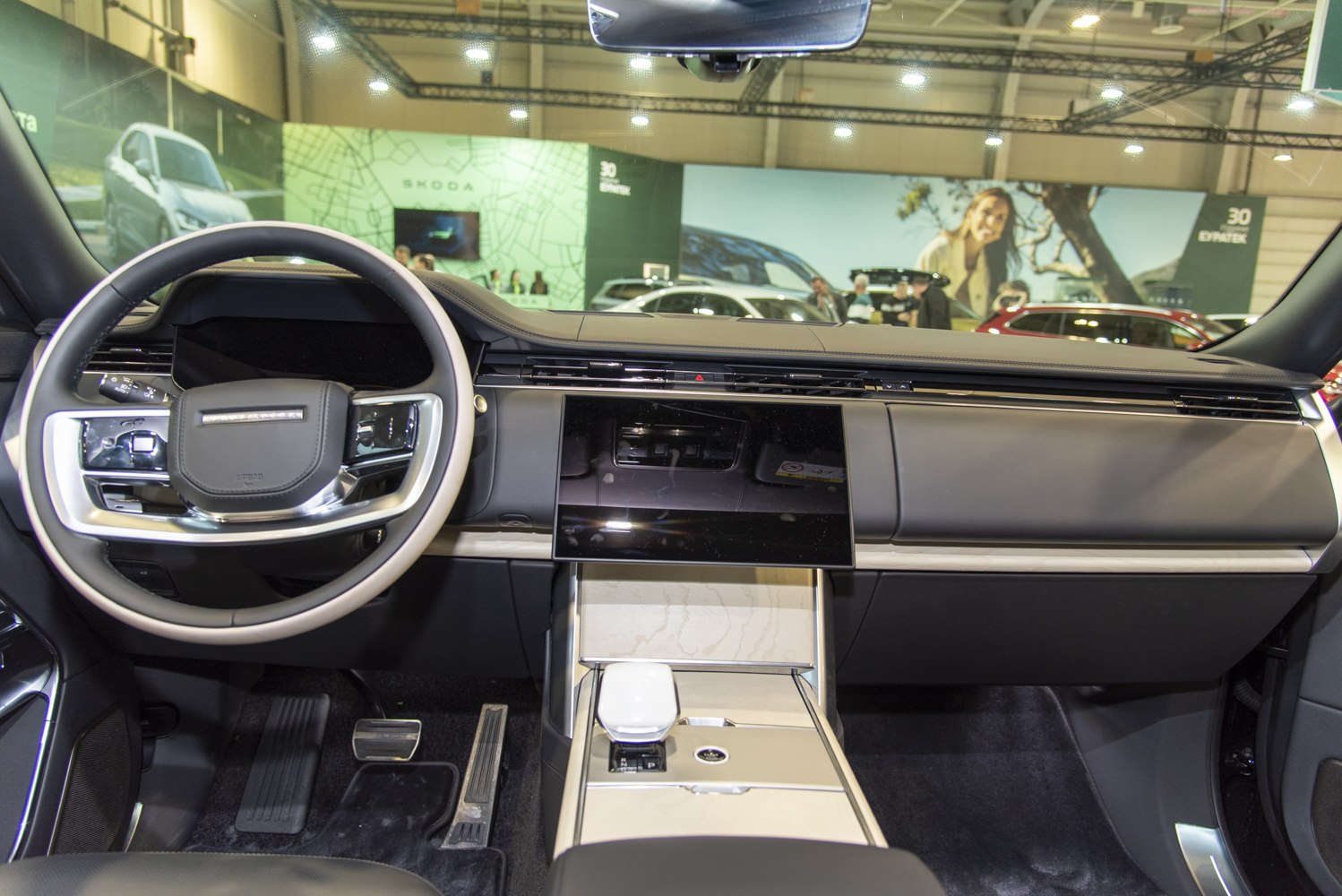 Modern dashboard and luxury steering wheel with touchscreen control