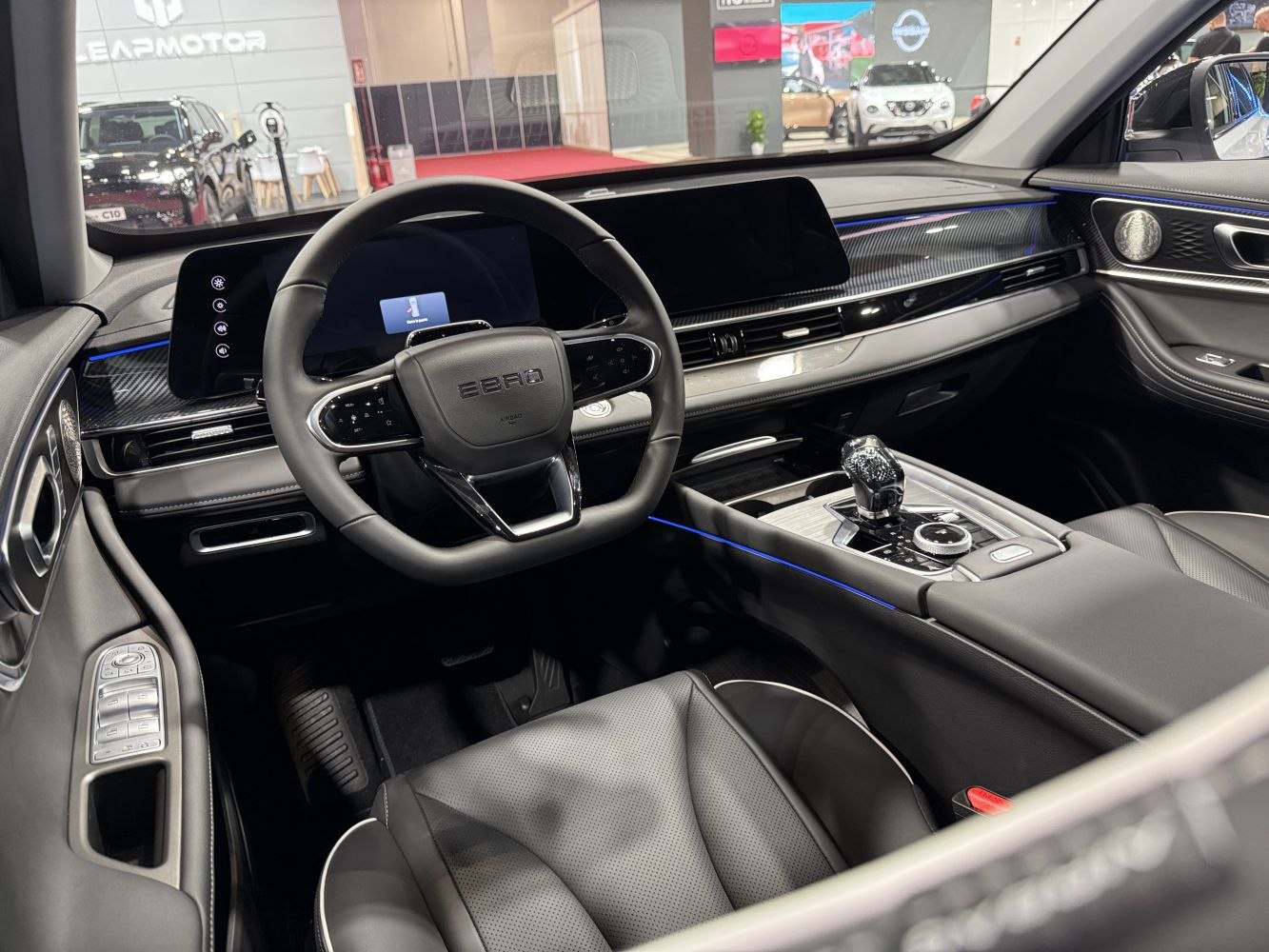 Digital dashboard and modern steering wheel in luxury car interior