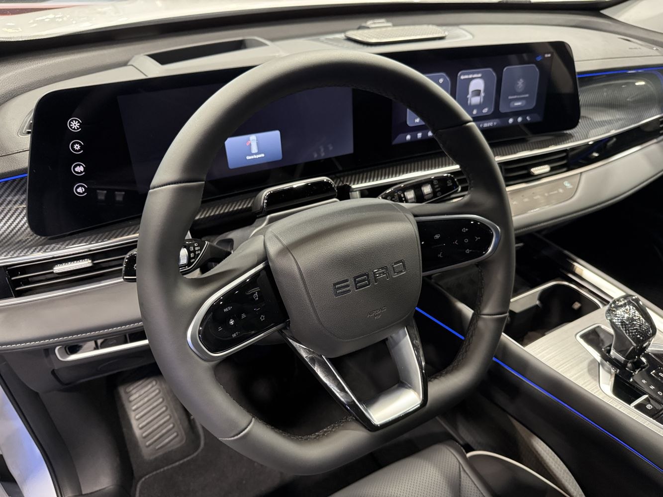 Modern digital cockpit with multifunction steering wheel and ambient lighting