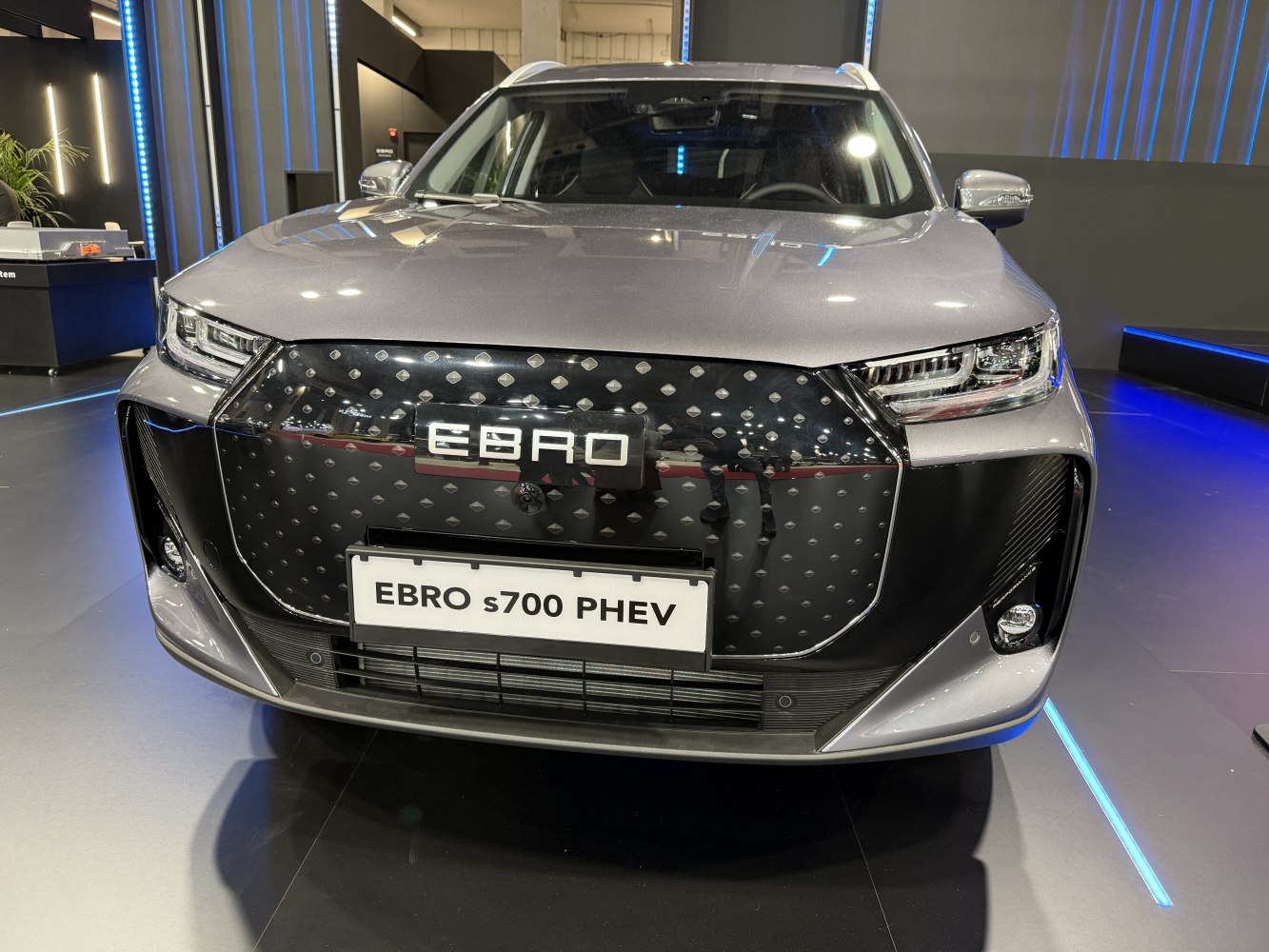 Modern front grille and sleek LED headlights of SUV