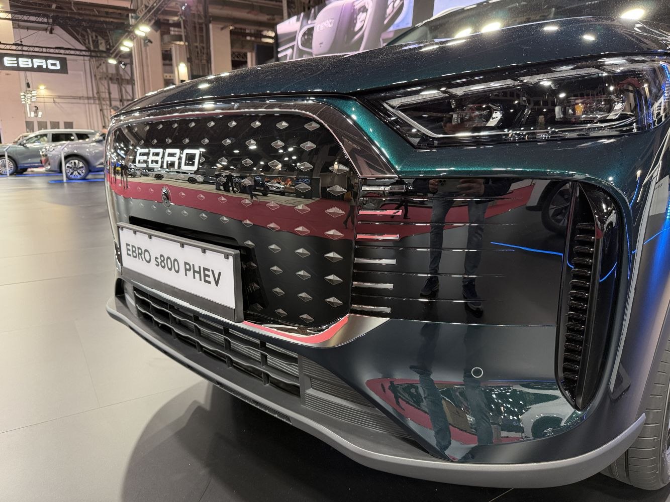 Close-up of car front grille and modern headlight design
