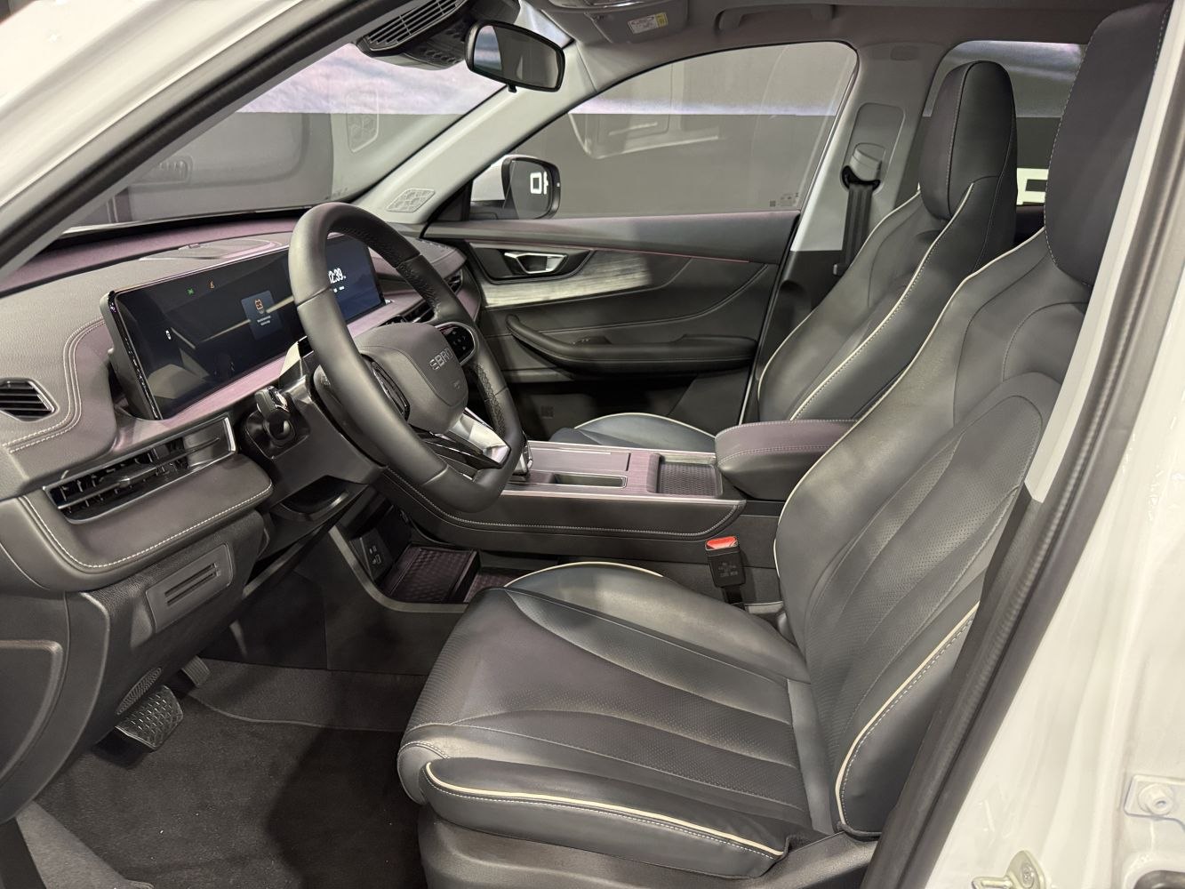 Modern dashboard with digital displays and premium leather seats