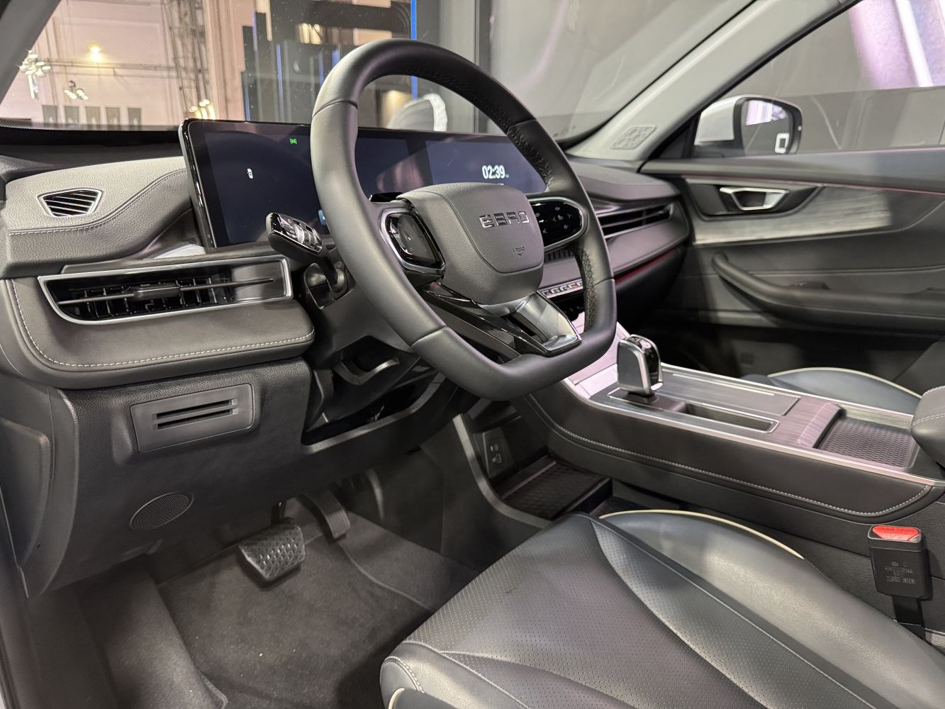 Steering wheel and digital instrument cluster in a modern car interior