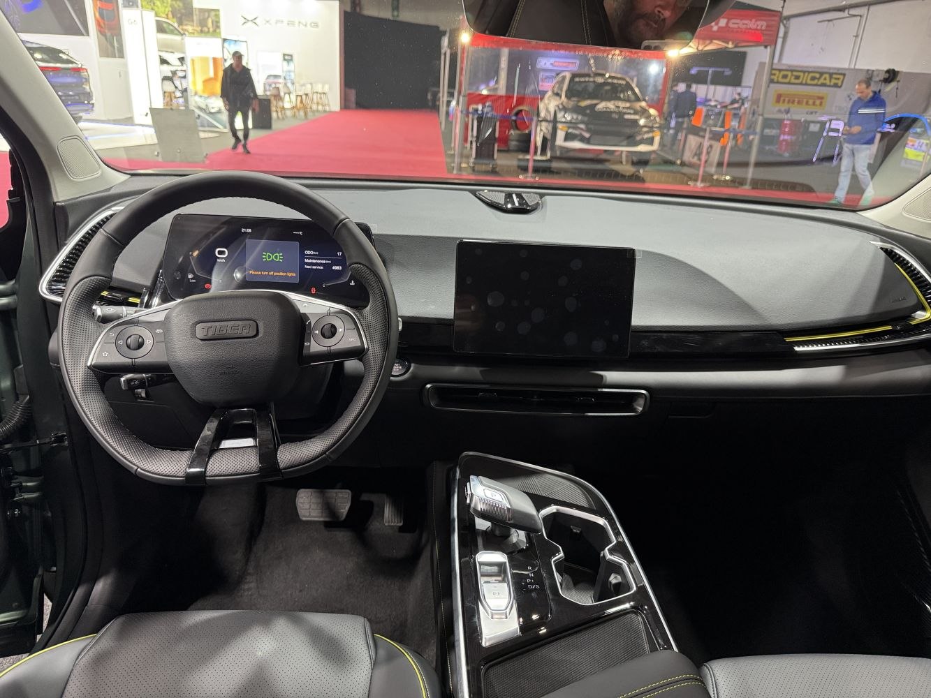Digital instrument cluster and touchscreen infotainment with gear selector and steering wheel controls
