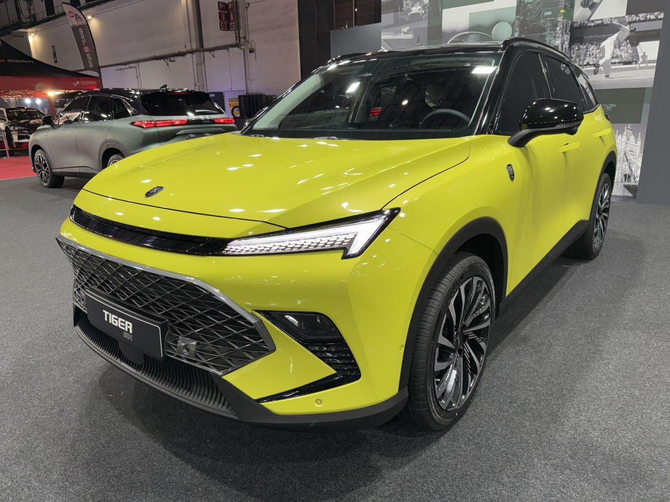 Front view of a modern SUV with angular LED headlights and large mesh grille.