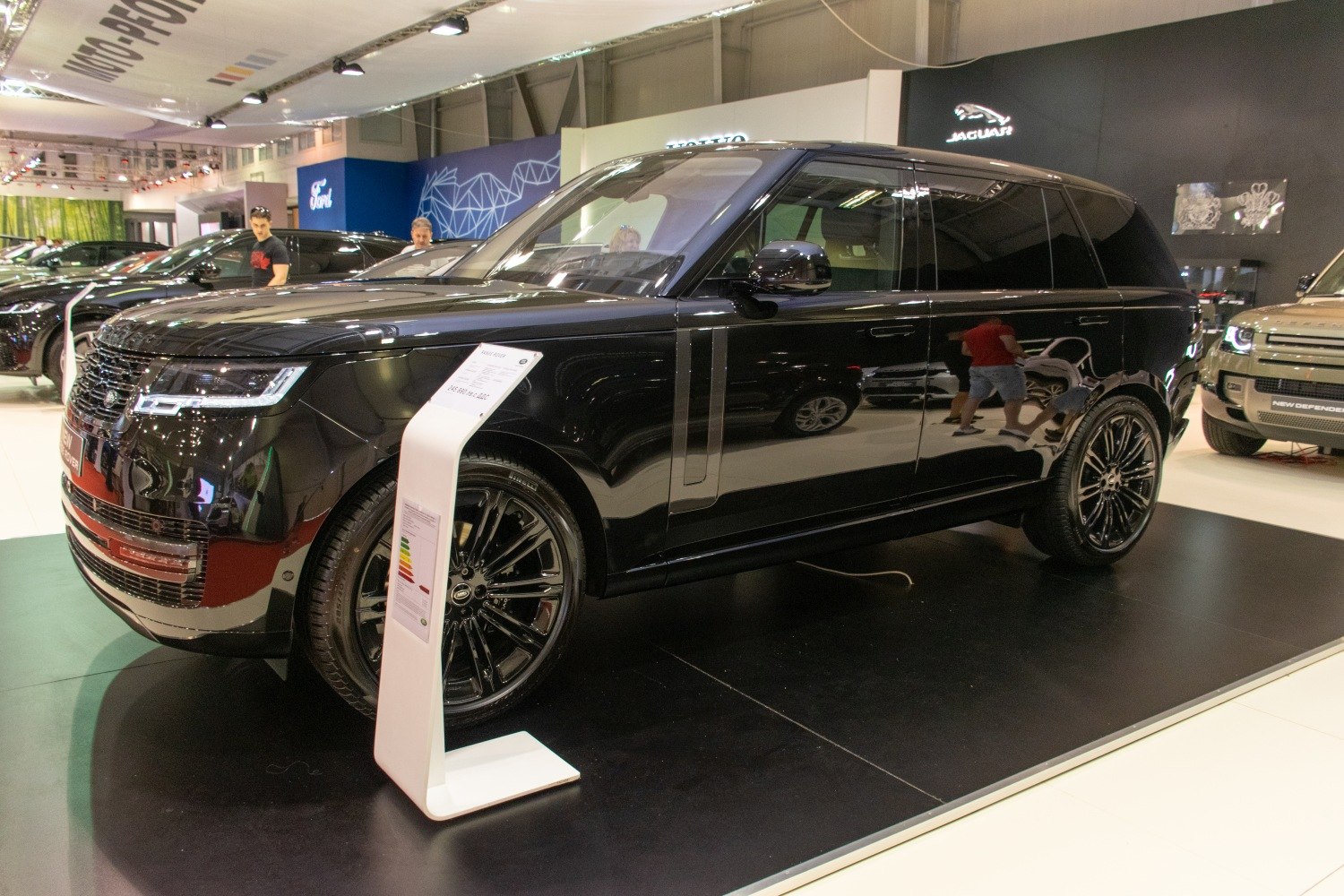 Luxury full-size black SUV with glossy finish and stylish wheel design