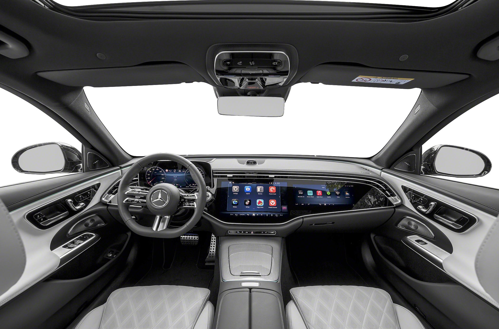 Dual widescreen digital displays and luxury quilted seats in a modern vehicle interior